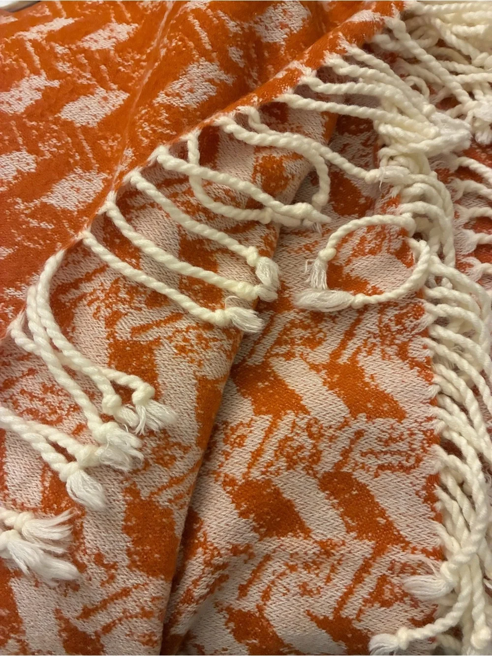 Threshold soft woven throw with knotted tassels. 60”x50”.